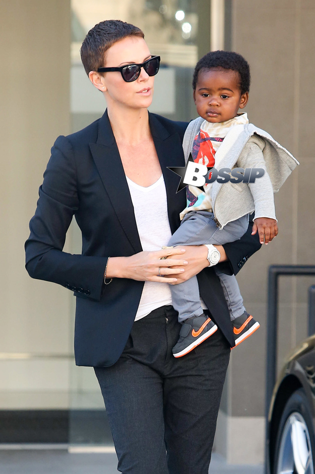 Charlize Theron holds onto her adorable baby boy Jackson as they leave a medical building in Beverly Hills this morning. The 37-year-old actress, her mother Gerda and Jackson made their way through the parking lot after the doctor's appointment.