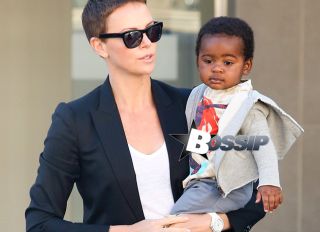Charlize Theron holds onto her adorable baby boy Jackson as they leave a medical building in Beverly Hills this morning. The 37-year-old actress, her mother Gerda and Jackson made their way through the parking lot after the doctor's appointment.
