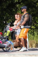 Chicago Bear's Julius Peppers, 33, spends a day at the beach with his family in Miami Beach, FL. Julius was seen pushing his son a stroller on the way back to his hotel.