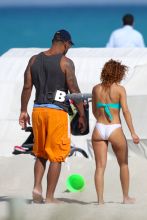Chicago Bear's Julius Peppers, 33, spends a day at the beach with his family in Miami Beach, FL. Julius was seen pushing his son a stroller on the way back to his hotel.