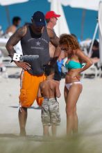 Chicago Bear's Julius Peppers, 33, spends a day at the beach with his family in Miami Beach, FL. Julius was seen pushing his son a stroller on the way back to his hotel.