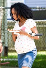 Yaya DaCosta shows off her baby bump on the set of "And So It Goes", a new film starring Michael Douglas and Diane Keaton. The "America's Next Top Model" star showed off her natural beauty in a fitted t-shirt, blue mini skirt, and keeping her hair big and curly.
