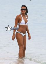 Cassie flaunts her hot bod in a white bikini while enjoying a day at the beach in Miami, Florida on July 27,