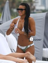 Cassie flaunts her hot bod in a white bikini while enjoying a day at the beach in Miami, Florida on July 27,