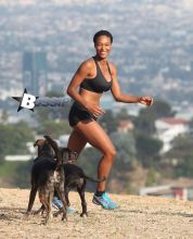 Actress Montana Fishburne, daughter of actor Laurence Fishburne, takes her dogs on playful hike through the Hollywood Hills on July 29, 2013.