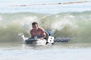 'Bolden!' actor Robert Ri'chard shows off his fit physique while catching a few waves in Malibu, California on November 4, 2013.