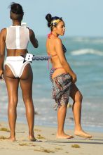 Reality star Angela Simmons shows off her curves as she spends the day with a friend at South Beach in Miami.