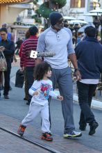 American former professional basketball player Cuttino Mobley and his son Mobley Jr. are seen doing a bit of last minute Christmas shopping.