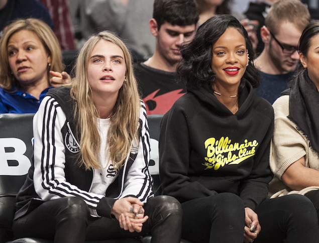 Rihanna and Cara Delevingne enjoy the Brooklyn Nets game as they play the Atlanta Hawks at the Barclays Center in Brooklyn