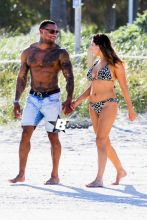 British model Kelly Brook and boyfriend David McIntosh show off their toned beach bodies as they spend the day at the Shore Club in Miami.