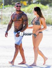 British model Kelly Brook and boyfriend David McIntosh show off their toned beach bodies as they spend the day at the Shore Club in Miami.