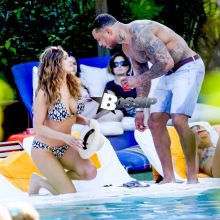 British model Kelly Brook and boyfriend David McIntosh show off their toned beach bodies as they spend the day at the Shore Club in Miami.