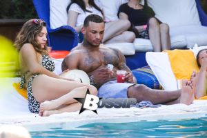 British model Kelly Brook and boyfriend David McIntosh show off their toned beach bodies as they spend the day at the Shore Club in Miami.
