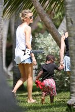 Charlize Theron touches down in Miami, Florida with her son Jackson to do a photo shoot on March 19, 2014.