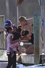 Charlize Theron touches down in Miami, Florida with her son Jackson to do a photo shoot on March 19, 2014.