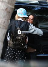 Actress Michelle Rodriguez and supermodel Cara Delevingne kiss before hopping in a car on their way to a music festival in Miami, FL. The rumored couple are on holiday in Florida after spending a week in Mexico.