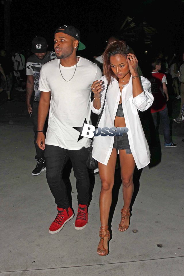 Karrueche Tran enjoyed a date night at the LA Clippers vs. OKC Thunder game in LA. She looked hot in an unbuttoned white shirt over a crop top and very short shorts. Chris’ other ex-Rihanna also happened to be in attendance with her renewed interest Drake!