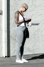 Amber Rose stops by a spa in Studio City with a male friend.