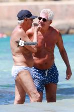 Giorgio Armani soaks up the sun during a Spanish escape in Ibiza, Spain. The Italian fashion designer hung out with Roberta Armani and her new boyfriend along with some other friends, as he enjoyed some time in the ocean.