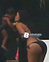 21 Jul 2014, Mexico ---Kim Kardashian takes a walk on the beach in Mexico with Kanye West and baby North Pictured: Kim Kardashian takes a walk on the beach in Mexico with Kanye West and baby North --- Image by © Splash News/Splash News/Corbis