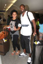 Gilbert Arenas and his significant other Laura Govan pose for pictures as they make their way through the terminal at LAX. The three-time NBA All-Star has done very well for himself after the end of his professional career. Arenas pulled in nearly $25 millions dollars last year while not actually playing in the NBA!