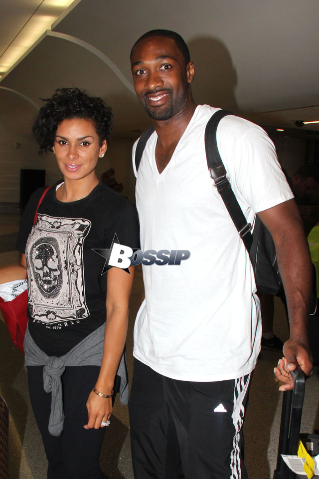 Gilbert Arenas and his significant other Laura Govan pose for pictures as they make their way through the terminal at LAX. The three-time NBA All-Star has done very well for himself after the end of his professional career. Arenas pulled in nearly $25 millions dollars last year while not actually playing in the NBA!