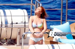 Former child star turned party girl Lindsay Lohan teaches her little sister the ropes as the two soak up the sun and relax while on board a luxury yacht in Capri.