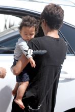 Halle Berry steps out with her 9 month old son, Maceo this afternoon for some mother-son time. The actress carried her little boy in one arm while holding a giraffe toy in hand. It looks like Maceo wanted his favorite toy had his eyes on it the whole time. Halle was dressed for the warm weather wearing a black high-low dress, which revealed what may possibly a baby bump. Could Halle be pregnant with her third child?