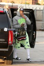 Chris Brown spotted crossing the street while smoking a cigarette outside the Barclays Center in Brooklyn, NY