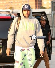 Chris Brown spotted crossing the street while smoking a cigarette outside the Barclays Center in Brooklyn, NY