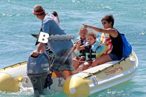 Halle Berry smiles ear-to-ear as she and her daughter, Nahla, get ready to go parasailing during their family vacation in Hawaii. Meanwhile, Halle's husband Olivier Martinez, stayed on shore with their son, Maceo.