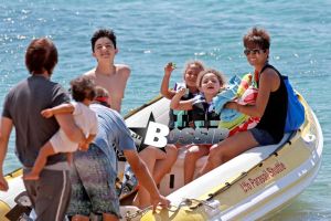 Halle Berry smiles ear-to-ear as she and her daughter, Nahla, get ready to go parasailing during their family vacation in Hawaii. Meanwhile, Halle's husband Olivier Martinez, stayed on shore with their son, Maceo.