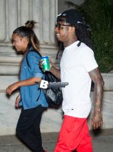 Lil Wayne and Christina Milian take romantic stroll on the streets of Philadelphia, PA. The couple look happy in love, holding hands and hugging.
