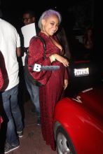 Raven-Symoné is looking radical in red with her partially shaved head with purple highlights. Raven shows of a beautiful smile as she poses for a photo, leaving the Roxy after seeing the Wiz Khalifa show.