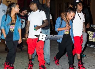 Lil Wayne and Christina Milian take romantic stroll on the streets of Philadelphia, PA. The couple look happy in love, holding hands and hugging.
