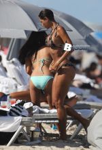 Nicole Murphy makes a splash as she hits the beach on Labor Day.