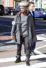 Singer Usher takes a morning stroll in Georgetown with his girlfriend Grace Miguel on November 11, 2014 in Washington, D.C. Usher may be trying to relive the excitment of finding a prize at the bottom of a cereal box. His new single "Clueless" will only be available to download off boxes of specially marked Honey Nut Cheerios at Walmart stores across the country.