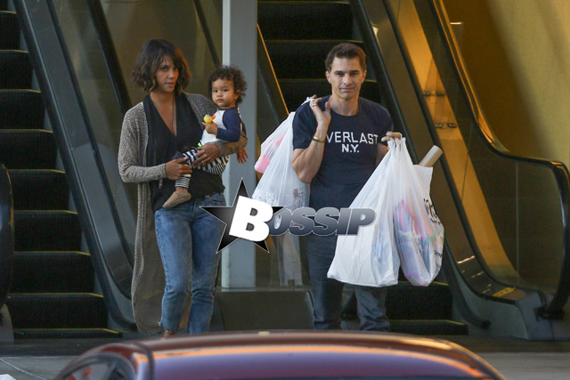 Halle Berry visits the chiropractor after suffering a tiny accident recently, when she swiped a yellow pole while trying to find a parking spot. The actress was accompanied by her husband, Olivier Martinez and their adorable son, Maceo. After Halle's finished up at the chiropractor's, the family-of-three went shopping at Michaels.
