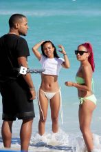 Karrueche Tran forgets about Chris Brown with a fun and relaxing trip to the beach in Miami with a couple of friends. The brunette beauty showed off her amazing beach body wearing a white bikini with a white crop top.