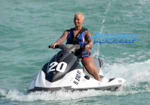 Amber Rose leaves little to the imagination as she wears a pink thong bikini on the beach in Miami, Florida. Rose can be seen having good time on a jet ski in Miami.