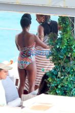 Queen Latifah just knows how to get the most of out her vacation, after going sightseeing in a helicopter this morning the 44-year-old rapper/actress/TV host and her partner Eboni Nichols, enjoyed the warm Rio weather sipping Champagne and dancing with friends poolside at the trendy Hotel Fasano. Latifah showed off her figure wearing a two piece turquoise bikini while Nichols looked great wearing a one piece colored patterned swimsuit.