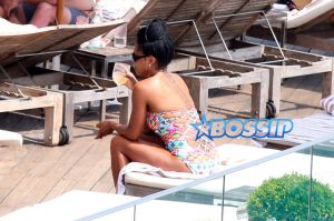Queen Latifah just knows how to get the most of out her vacation, after going sightseeing in a helicopter this morning the 44-year-old rapper/actress/TV host and her partner Eboni Nichols, enjoyed the warm Rio weather sipping Champagne and dancing with friends poolside at the trendy Hotel Fasano. Latifah showed off her figure wearing a two piece turquoise bikini while Nichols looked great wearing a one piece colored patterned swimsuit.