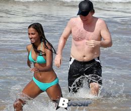 TV personality Bill Maher and Anjulie Persaud enjoying a day on the beach in Maui, Hawaii on January 4, 2015. Bill and Anjulie laughed and joked as they played around in the waves. Anjulie won a Juno Award in 2013 for Best Dance Recording Of The Year for her song 'You And I'. FameFlynet
