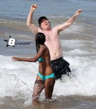 TV personality Bill Maher and Anjulie Persaud enjoying a day on the beach in Maui, Hawaii on January 4, 2015. Bill and Anjulie laughed and joked as they played around in the waves. Anjulie won a Juno Award in 2013 for Best Dance Recording Of The Year for her song 'You And I'. FameFlynet