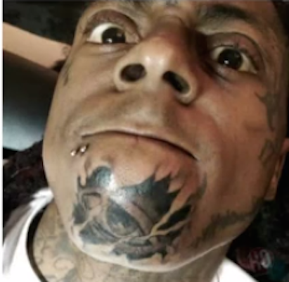 Drake Gets Lil Waynes Face Tattooed on His Arm