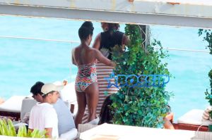 Queen Latifah just knows how to get the most of out her vacation, after going sightseeing in a helicopter this morning the 44-year-old rapper/actress/TV host and her partner Eboni Nichols, enjoyed the warm Rio weather sipping Champagne and dancing with friends poolside at the trendy Hotel Fasano. Latifah showed off her figure wearing a two piece turquoise bikini while Nichols looked great wearing a one piece colored patterned swimsuit.