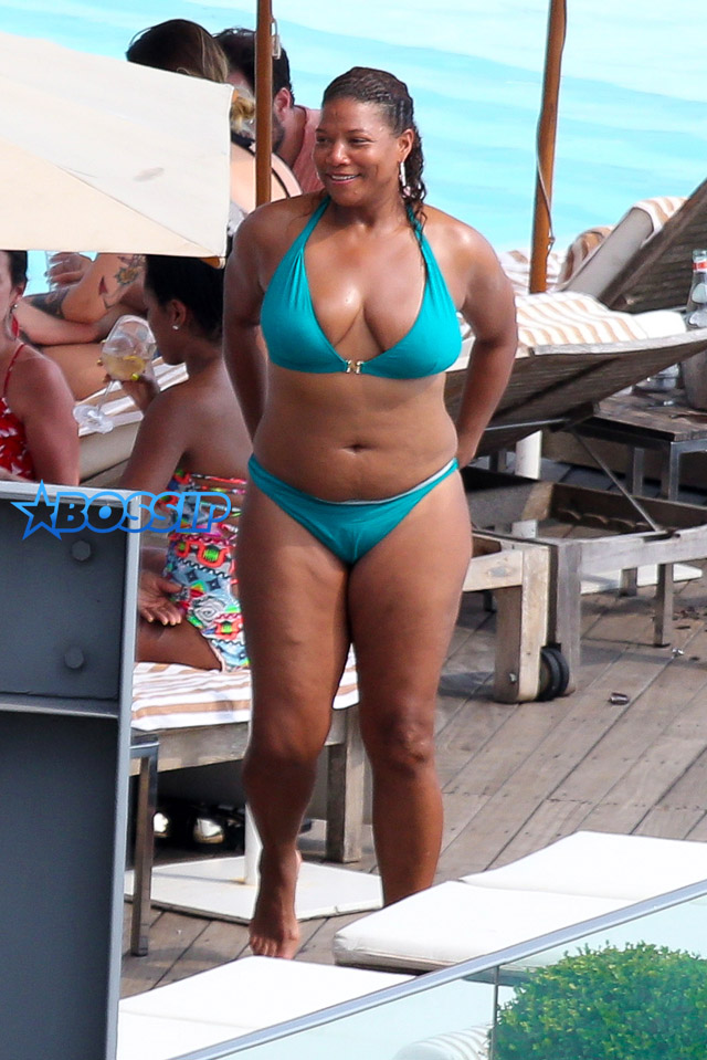 Queen Latifah, 53, models a plunging swimsuit as she enjoys a