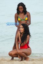 **USA ONLY** Miami, FL - Rapper Rev Run's daughter Angela, known for their family reality show 'Run's House,' is clearly all grown up! The 27-year-old curvy babe was spotted having fun with her girlfriends on a beach in Miami on Monday, wearing a 'Baywatch'-style red Wildfox one piece with the words "This Bod's For You" written across the front. The girls laughed and played in the sand, practicing their yoga backbends while snapping photos.
