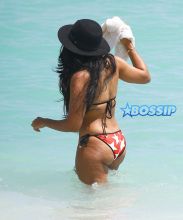 Socialite Angela Simmons shows off her bikini body as she enjoys a dip in the ocean on March 25, 2015 in Miami, Florida.
