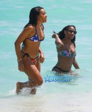 Socialite Angela Simmons shows off her bikini body as she enjoys a dip in the ocean on March 25, 2015 in Miami, Florida.